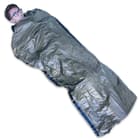 The olive drab sleeping bag is water and wind-proof and it reflects your body heat back to you