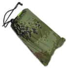 The bivy tarp comes in a drawstring carry pound and included, in a smaller pouch, are two iron ten pegs and four pieces of rope
