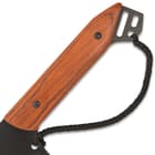The wooden handle scales are securely attached to the tang with stainless steel pins and there is a wrist cord handle loop