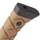 The knife has a tan, twice injected, cross-ridged handle grip, secured with heavy-duty screws and it has a TPU pommel
