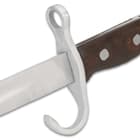 Our authentic reproduction has a 16” high carbon iron blade a hefty metal muzzle ring and the handle scales are wood
