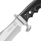 The knife’s 6 7/8” stainless steel blade is laser-etched with the Hibben Knives logo and Alaska Professional Hunters Association Seal.