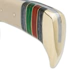 The handle is crafted of natural bone, accented with red, green and black wooden panels and brass spacers