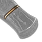The gently curved, flat Damascus handle scales are accented by brass and black spacers and are secured with brass pins