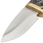 It has a full-tang, razor-sharp 4 1/2” stainless steel, full-bellied blade, extending from a polished brass half-guard