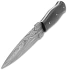 The knife has a full-tang, double-edged, 5 1/4” Damascus steel dagger blade with a penetrating point and sharp edges