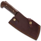 The cleaver can be stored in a leather belt sheath.
