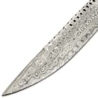 It has a razor-sharp, 9” Damascus steel blade with a fileworked spine, decorative circle cut-outs and a gut-hook