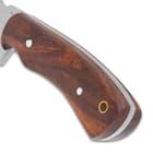 The handle scales are rustic brown hardwood
