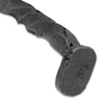 A close-up of the hammer-style pommel