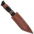 The fixed blade knife is 13 1/2” in overall length and can be stored and carried in the included, premium leather belt sheath