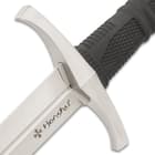 The grip is bookended by a cast 2Cr13 stainless steel pommel and hand guard, both with a satin finish