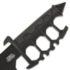 The trench knife handle is of cast metal with black, no-slip rubberized grip inserts and it features a skull crusher pommel