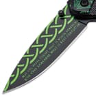 It has a black, 3 1/2” stainless steel blade with green, 3D printed artwork of Celtic design and an Irish proverb