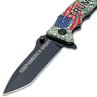 The stainless steel blade is laser-etched with the message, “Keep America Great”