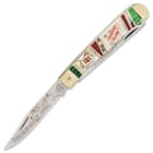 The trapper has two sharp 440 stainless steel blades, which feature Christmas themed etchings and our limited edition stamp
