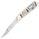 The pocket knife has razor-sharp 440 stainless steel blades with railroad themed etchings including the Kissing Crane stamp of quality