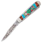 The pocket knife has razor-sharp 440 stainless steel blades with “Peace and Love” themed etchings including a VW bus