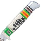 The handle has a white bone panel with a 3-D printed soldier silhouette, accented with the colors of the Vietnam service ribbon