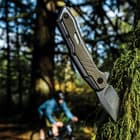 The stonewashed, stainless steel handle has an olive-colored, glass-filled nylon overlay for added thickness