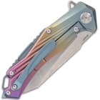 The handle scales are crafted of rainbow titanium-coated, aluminum and it features a titanium-coated pocket clip