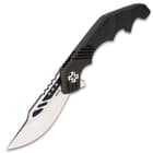 This knife has a massive 4 3/8” D2 tool steel blade with notching on the spine and a black oxide coated and bead-blasted finish