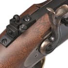 The 44 1/4” overall rifle has a front sling swivel fitted to the lower rib and a slotted stud in the stock