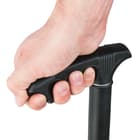 Close view of hand clutched on black handle constructed with fiberglass-reinforced nylon composite showing strong grip

