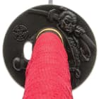The electroplated tsuba is intricately crafted of metal alloy with the likeness of Oda Nobunaga, regarded as the “Great Unifier”