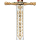 The high-quality, 47 1/5” overall sword has a stainless steel blade with an 8 1/5” width and is decorated with royal shields