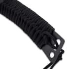 The handle is Samurai-wrapped in black cord with a lanyard left hanging from the lanyard slot at the end of the handle