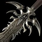 The 45” overall fantasy sword also features finely detailed cast metal hilt parts with an antiqued iron metal finish