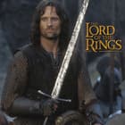 The Lord of the Rings character Aragorn holds the Sword of Strider.