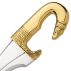 The 5” handle is crafted of solid brass, in a curved design, with intricate engraved patterns and a polished finish