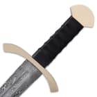 The Damascus handle is wrapped in genuine, black leather and the flat, curved pommel is crafted of polished brass