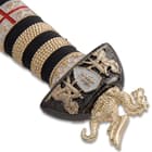 The handle is wrapped in genuine leather and gold metal cord and features a gold-tone aluminum pommel