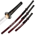 The three sword scabbards are maroon with natural pearl dragon design on the side. 