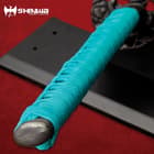 Katana handle wrapped in teal nylon cord with cast pommel. 