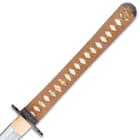 The white genuine ray skin handle is wrapped brown cord and has a gold colored menuki. 