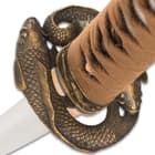 The keenly sharp, 26 1/2” handcrafted blade is forged of premium T10 steel and extends from a unique koi themed brass tsuba