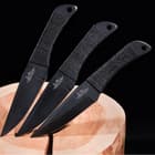 The three knives are made each made of stainless steel with black oxide coating.