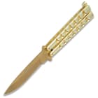Shown open, this knife has a 4” stainless steel blade with gold finish and gold colored skeletonized handle.