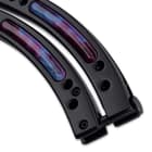 The black handles are of stainless steel with resin inserts that have the purple cosmic design to match the blade