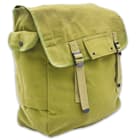 It has a large, main compartment with an open inner pocket and the top flap is secured with nylon webbing straps