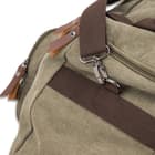 The 24”x 14”x 13” duffle backpack also has a nylon webbing adjustable shoulder strap and two, top handles with a leather grip