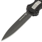 Upclose view of the benchmade infidel OTF pocket knife double edged blade with a "Benchmade" inscription in the upper corner.
