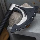 The deeply ridged handle is injection-molded, nylon reinforced fiberglass, secured to the axe head with sturdy steel bolts