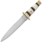 It has an 8 1/2” stainless steel, double-edged blade with a penetrating point and it extends from a brass handguard