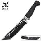 The knife’s black oxide coated blade has a modified tanto point and custom nylon belt sheath.