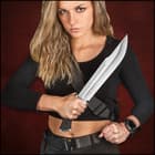 Angled view of the 16 1/2" overall bowie knife with 10 7/8” stainless steel blade and black TPR handle.